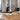 Rower mid stroke on a Concept2 RowErg on a timber floor