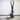 Concept2 SkiErg on the floor stand against a white brick wall
