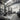 Row of Concept2 SkiErgs on floor stands in a functional gym