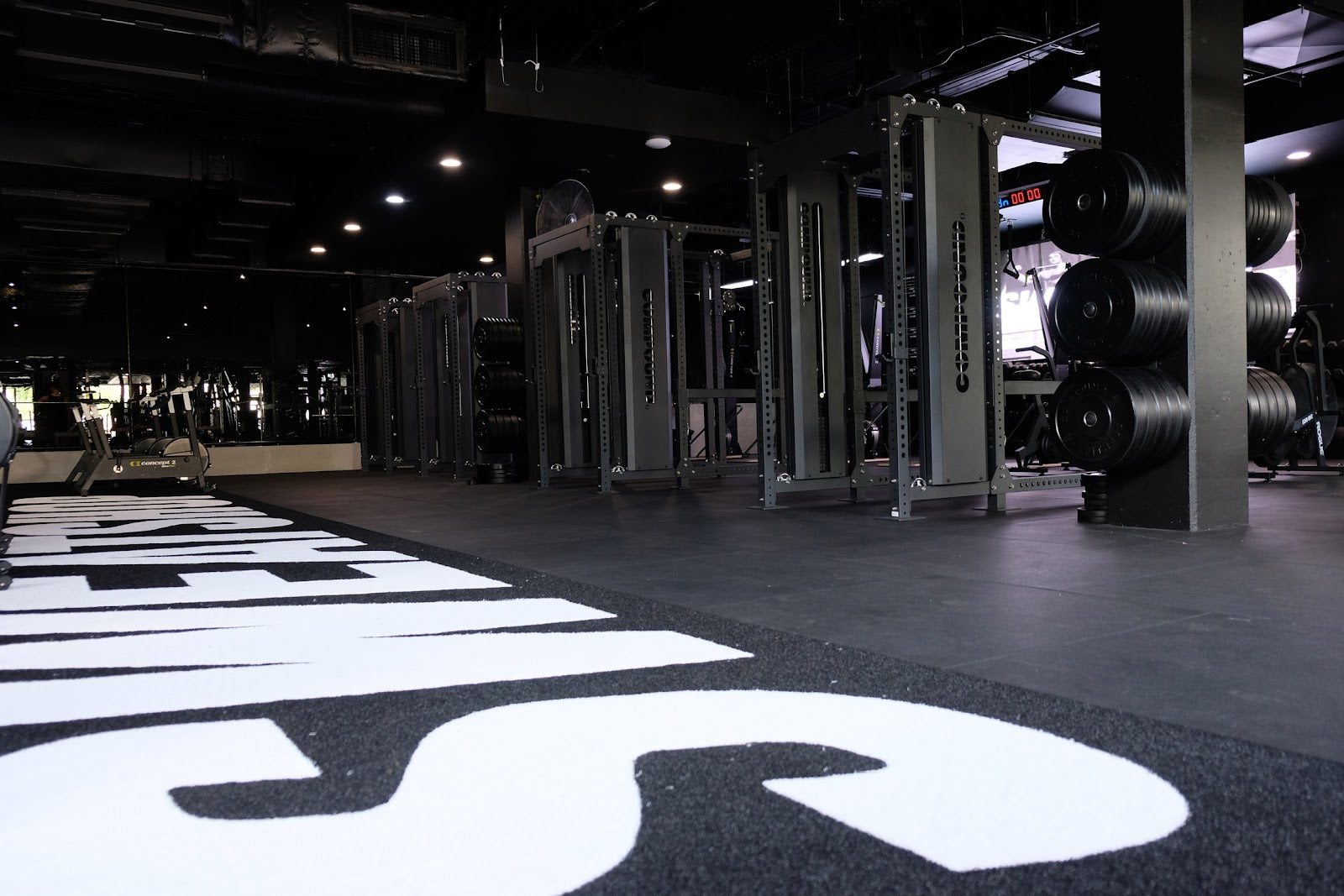 Branded gym turf and functional rack line in a 24/7 fitout by Compound Fitness