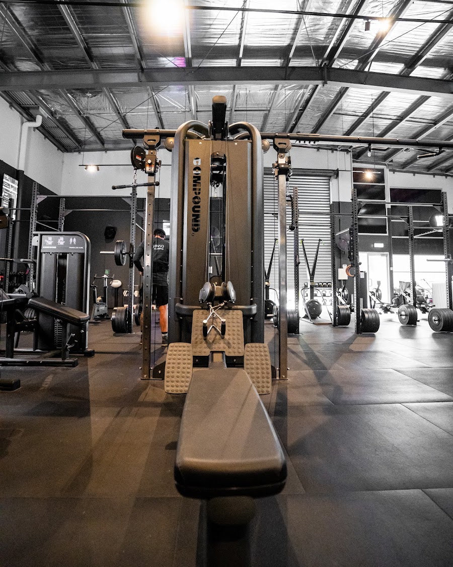 Warehouse scale 24/7 gym fitout with high steel ceiling by Compound Fitness