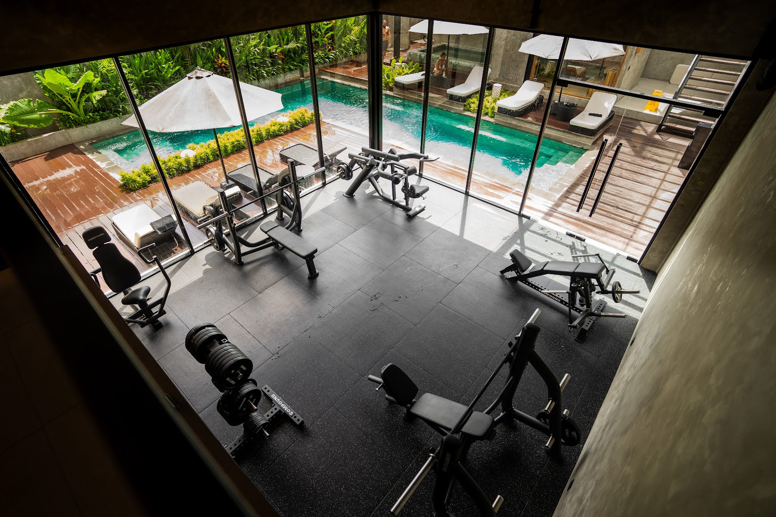 Poolside strength studio fitout with full commercial equipment by Compound Fitness